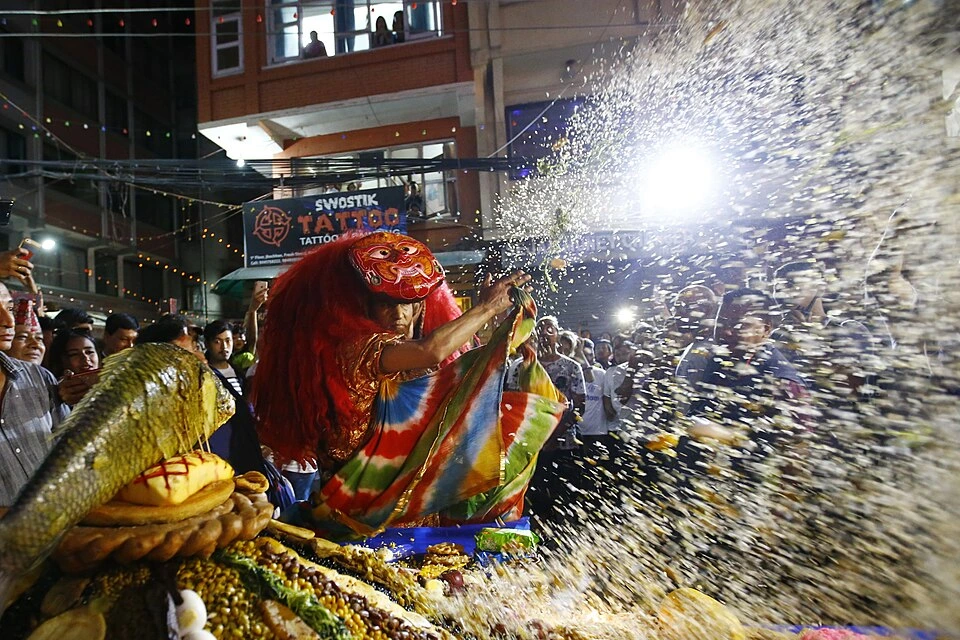 Indra Jatra festival features the vibrant and energetic Lakhey masked dance performance amidst cheering street crowds in Kathmandu.