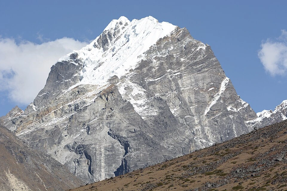 Lobuche East Peak Climbing showcases the majestic snow-capped summit and rugged rock faces rising high above Nepal's Khumbu region.
