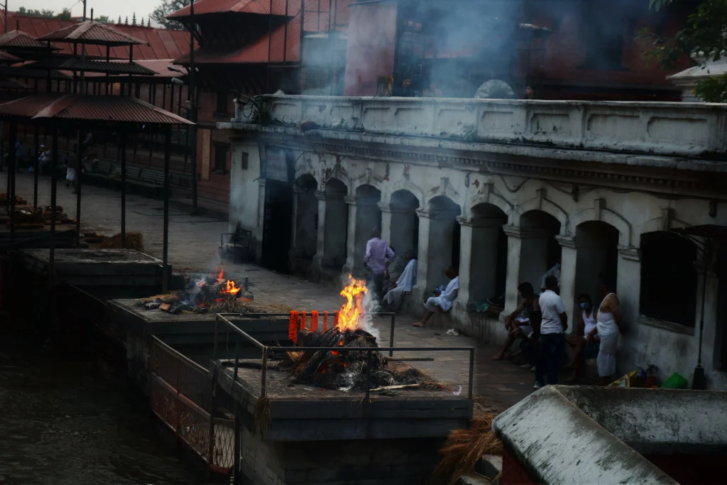 Hindu cremation ceremony at Masanghat along the Bagmati River in Pashupatinath