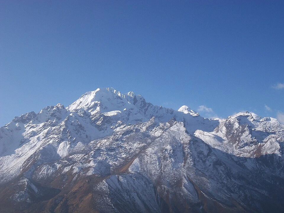 Naya Kanga Peak Climbing showcases the stunning snow-capped summit and rugged ridges rising majestically in Nepal's Langtang region.