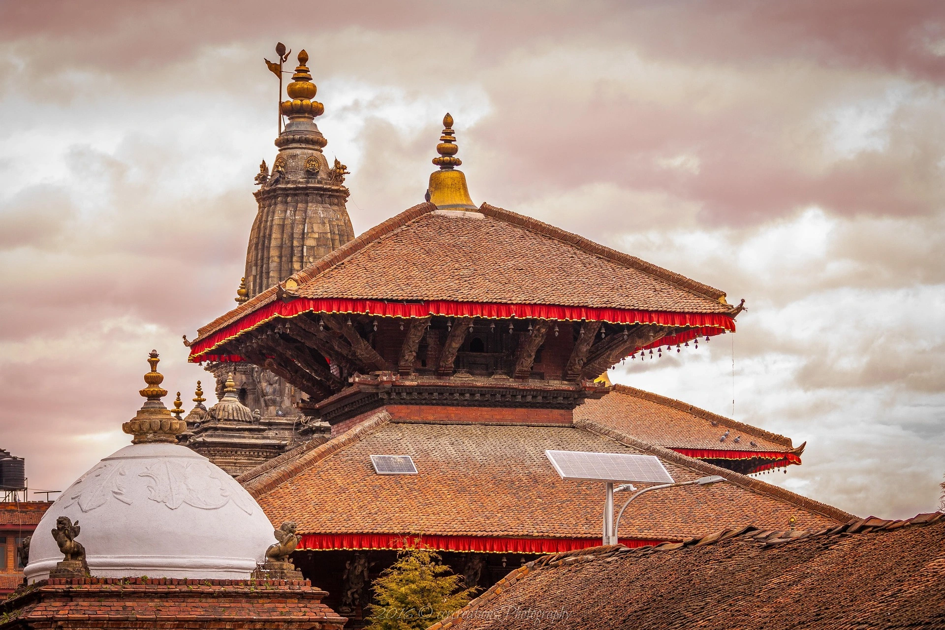 Traditional multi-tiered pagoda temple architecture and historic shrines at Kathmandu Durbar Square in the Kathmandu Valley