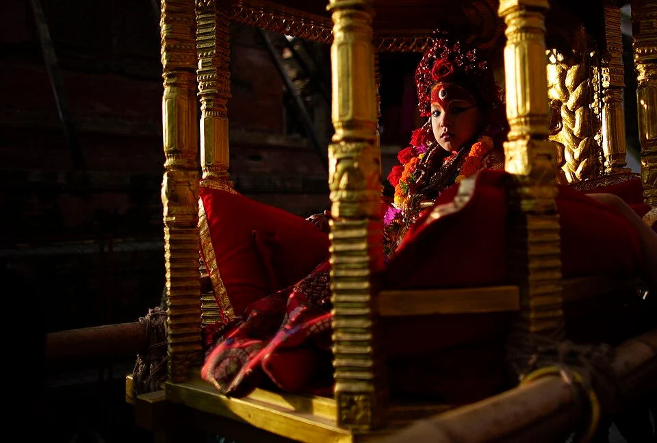 Indra Jatra festival reaches its sacred climax as the living goddess Kumari is paraded through the streets in an ornate golden chariot.