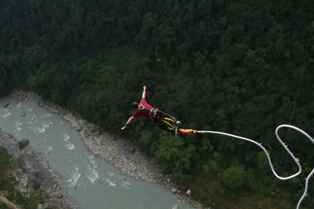 Bungee jumping over a river in Nepal
